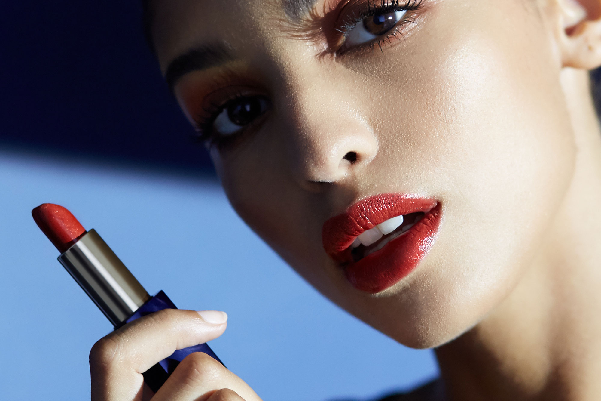 Estee Lauder | Lips | Model Holding Red Lipstick